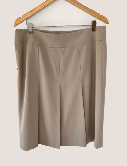 rear view of an Akris Punto khaki skirt showing its pleats and folds