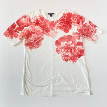 Full front, overhead view of a J.Crew flower tee with short sleeves and a realistic print of red peonies across the front