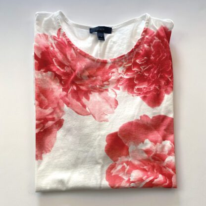 A view of a folded J.Crew flower tee, whosing the red peony print across the chest