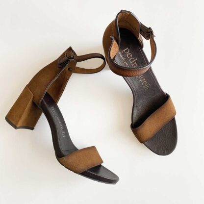 View showing the full front of the left shoe and a side profile of the right shoe of a pair of vintage Pedro Garcia sandals.