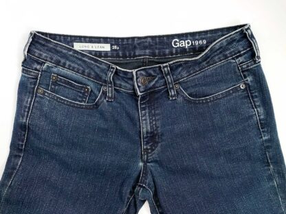Front view of the top half of a pair of vintage Gap Long and Leans jeans, showing the inner waistband text "Gap 1969" and "Long and Lean 28p."