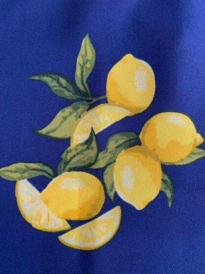 Close up view of the detail in the lemon print of a pre-loved Banana Republic blouse