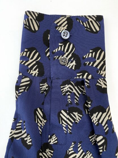 close up view of a sleeve for a J.Crew silk blouse in a zebra print
